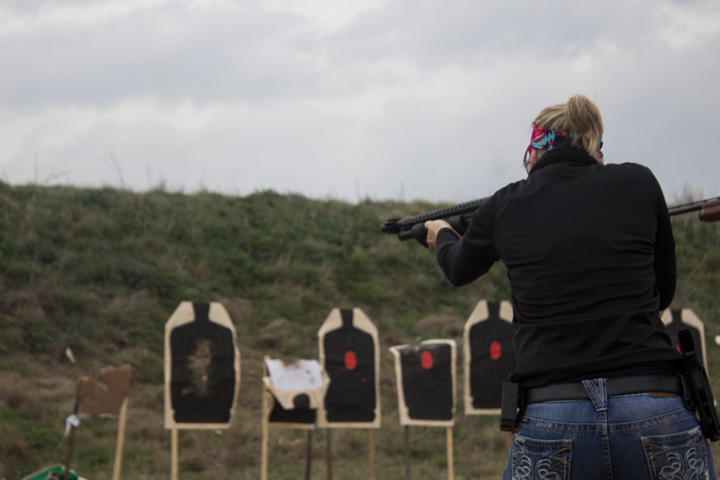  Ginger Peacock, who founded the Marietta, Ga. A Girl and A Gun chapter, takes aim during a shotgun home defense class at the T.I.G.E.R Valley outdoor range in Waco, Texas.
