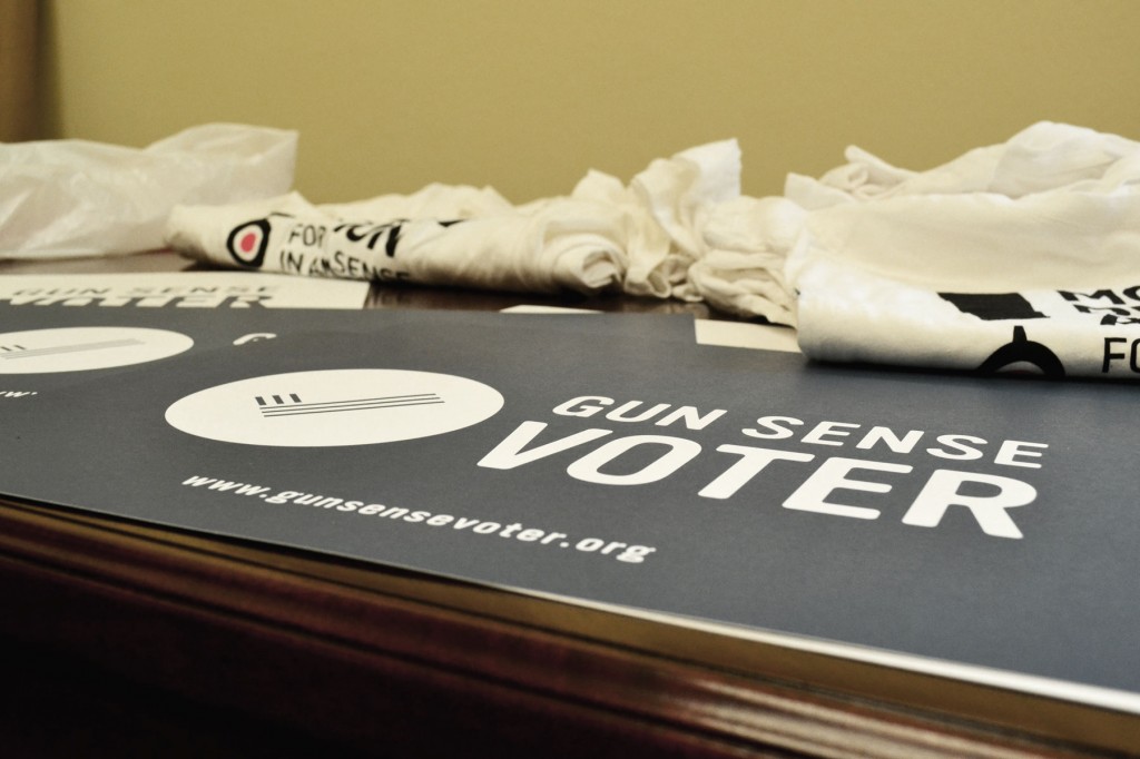 Posters bearing Everytown's "Gun Sense Voter" slogan sit on a table at a May 7 Moms Demand Action press conference on Capitol Hill in Washington. 