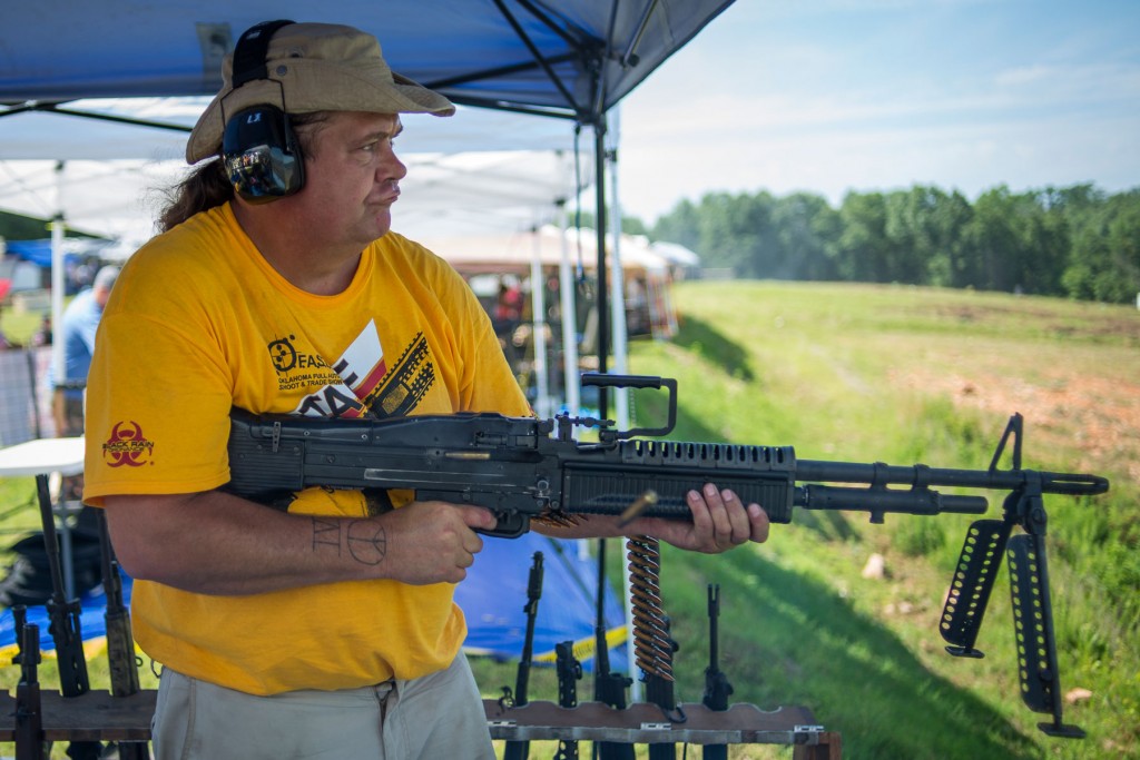 Licensed firearms dealer Kendall Beaver fires a fully automatic M60 rifle during the Oklahoma Full Auto Shoot and Trade Show in Wyandotte, Ok. on June 21.  Jim Tuttle 